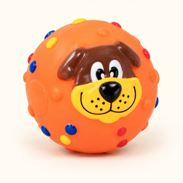 Pelota naranja con carita de perro y puntos de colores